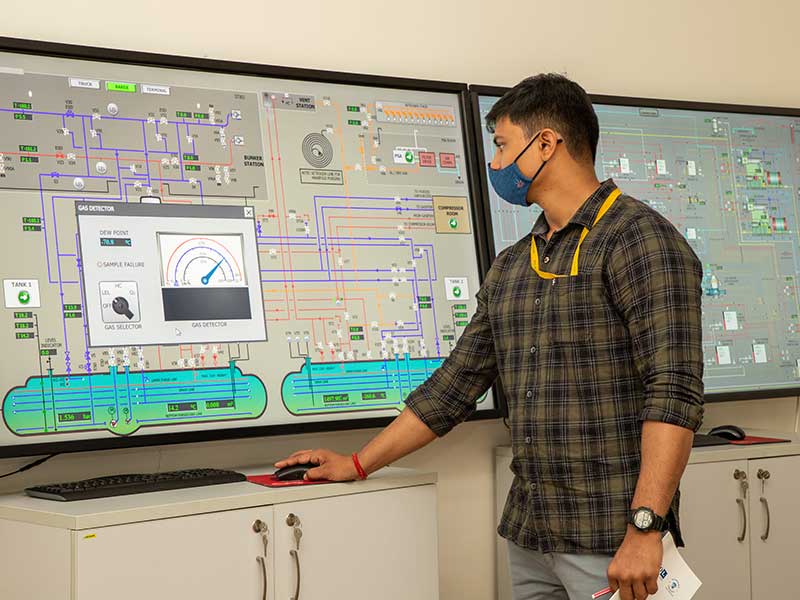 Personnel operating a dual fuel engine simulator at Synergy’s Marine Advanced Simulation and Training Centre