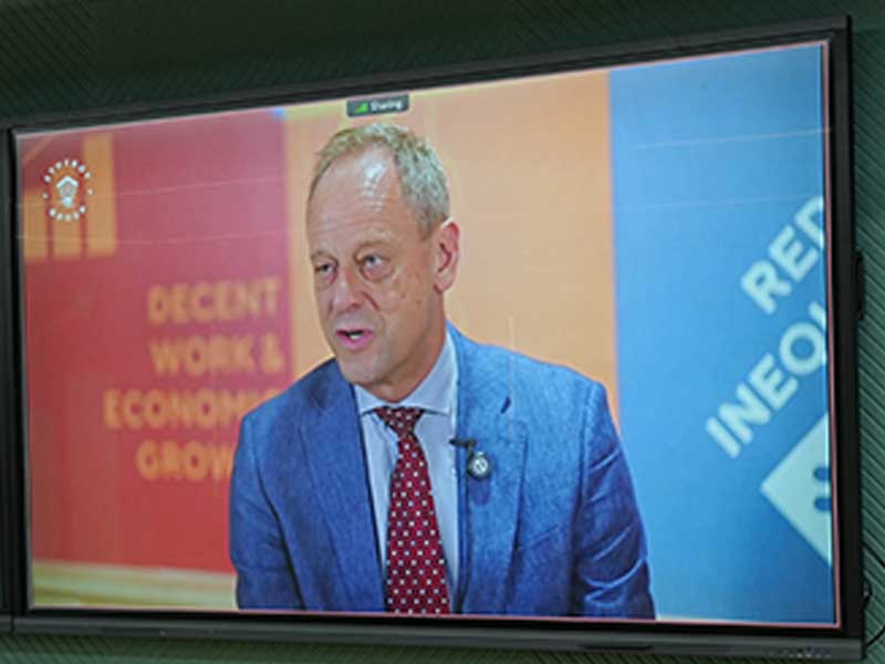 Virtual keynote speaker at the MACN Private Sector Engagement event, shown on a large screen alongside UN Sustainable Development Goals banners
