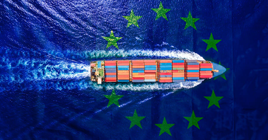 Aerial view of a container ship at sea with an EU flag overlay, representing compliance with EU ETS shipping regulations.