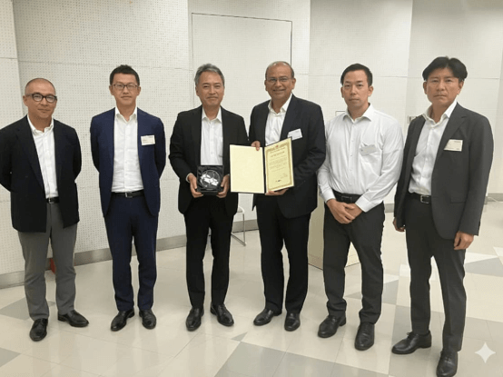 Synergy Marine Group leadership team receiving NYK Dry Bulk Award 2025 for KEY JOURNEY in Japan ceremony