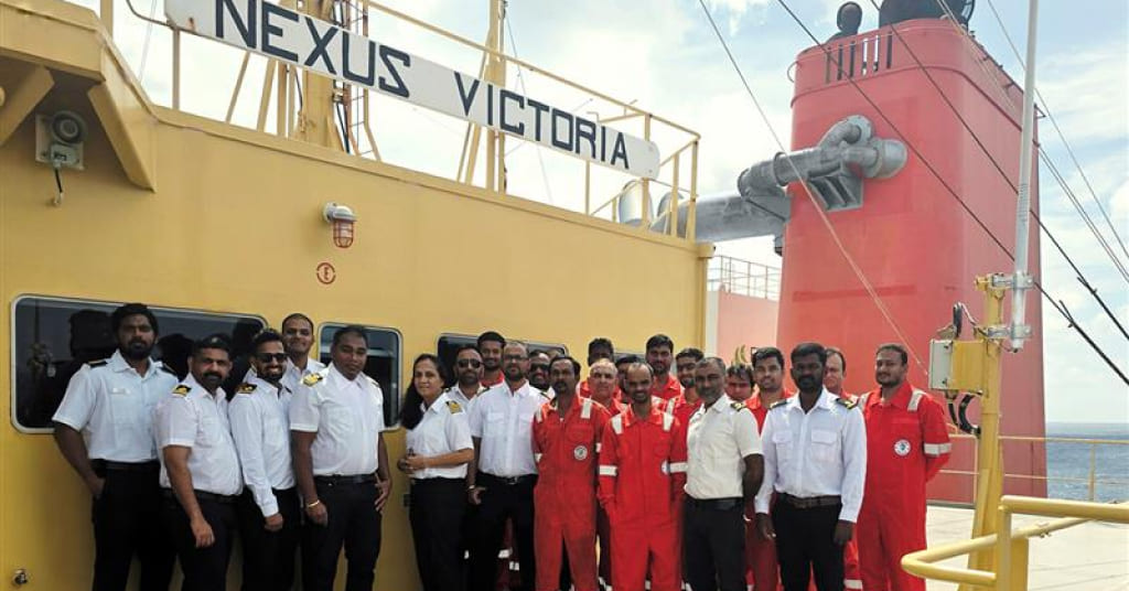 MT Nexus Victoria crew on deck, recognized for operational excellence by MOL Energia.