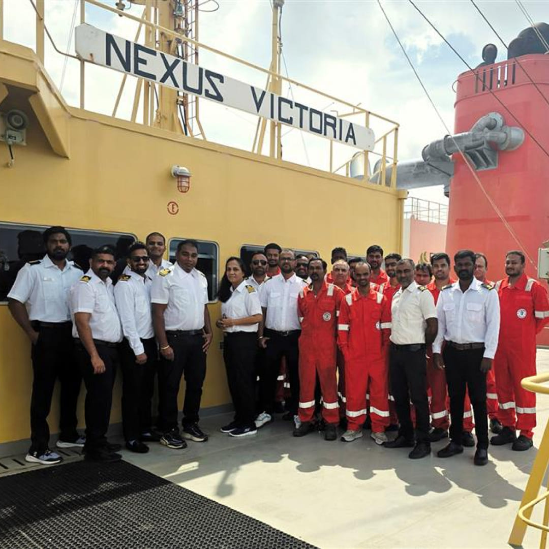 Crew of NEXUS VICTORIA on deck, celebrating recognition for leadership, safe operations, and maritime excellence.