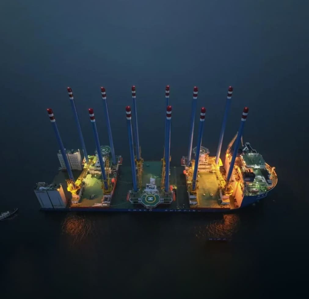 Night view of offshore jack-up barges managed by Synergy Marine Group in an agreement with Jana Marine Services.